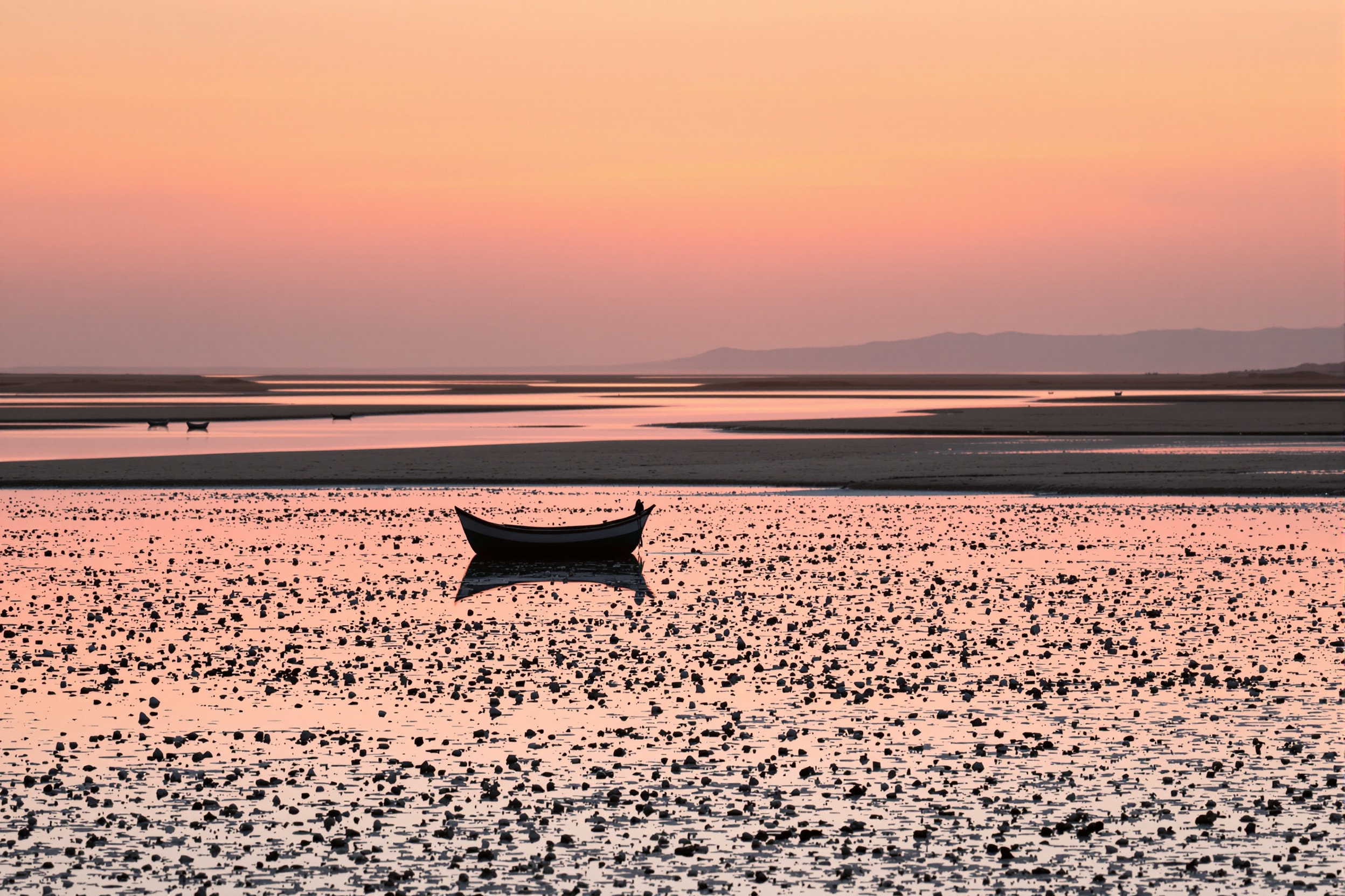Salt pans and tidal channels of the eastern Algarve lagoon at sunset