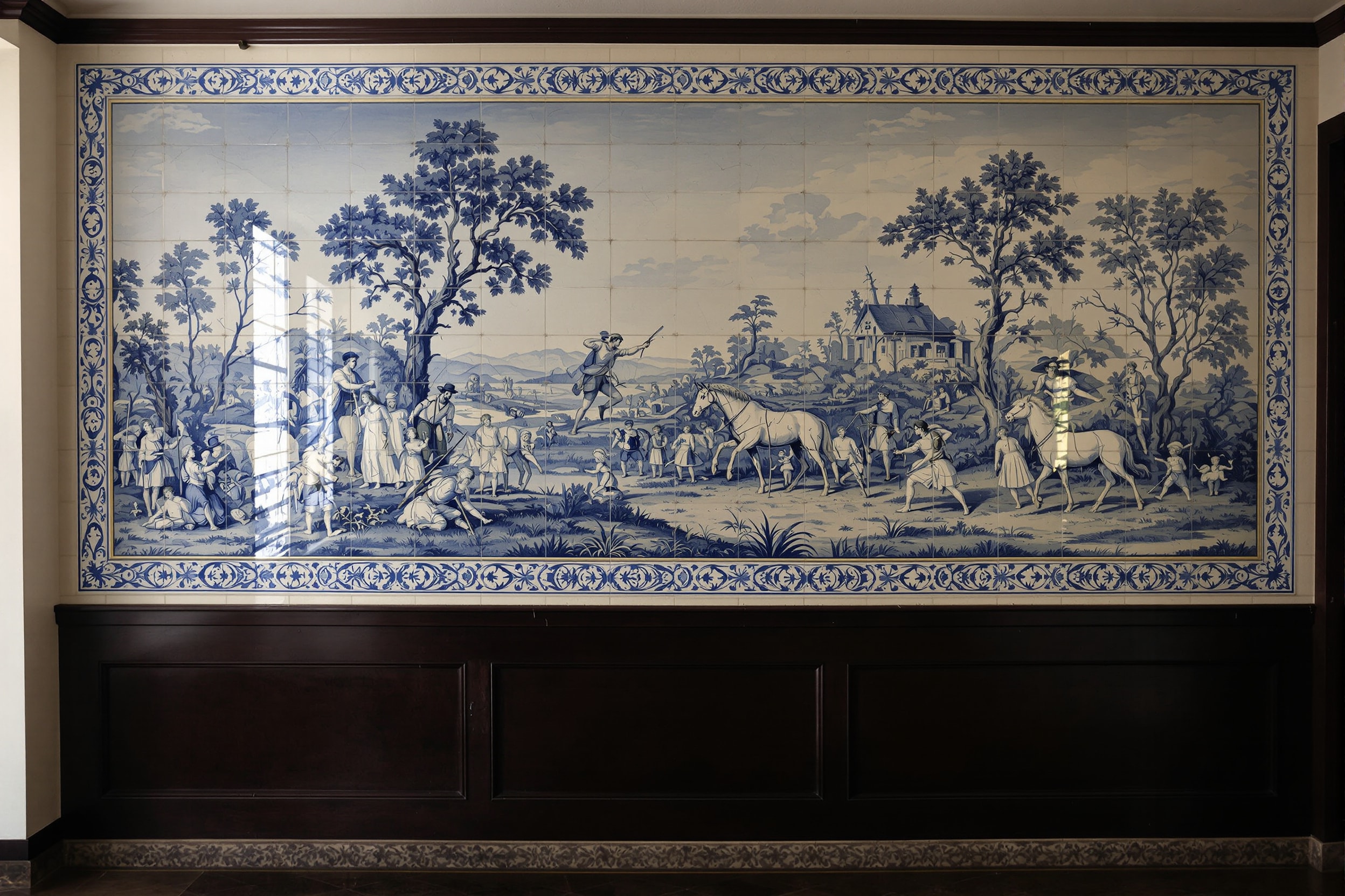 Blue and white eighteenth-century azulejo panel lining a manor house corridor